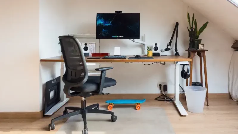 Mesh Chair Characteristics A desk with Chair and computer